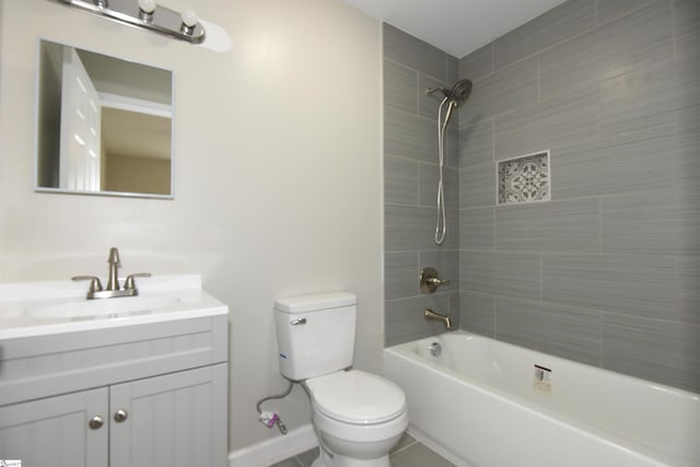 full bathroom featuring tile patterned flooring, vanity, toilet, and tiled shower / bath