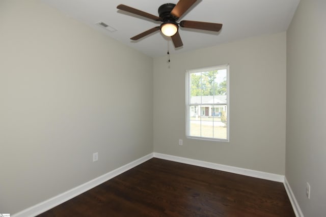 empty room featuring ceiling fan and dark hardwood / wood-style floors