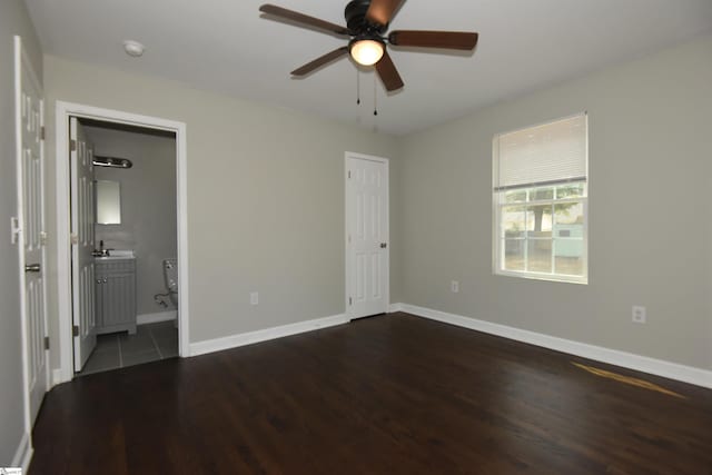 unfurnished bedroom with ceiling fan, tile patterned floors, and ensuite bathroom