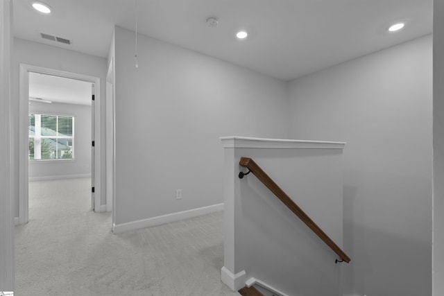 hall featuring visible vents, attic access, carpet floors, an upstairs landing, and recessed lighting