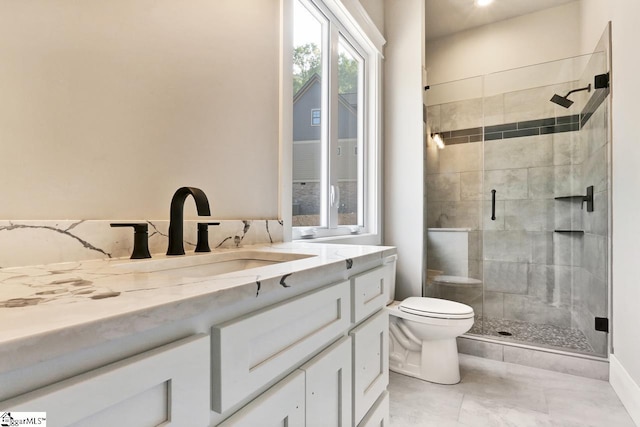 bathroom featuring vanity, toilet, tile patterned floors, and walk in shower