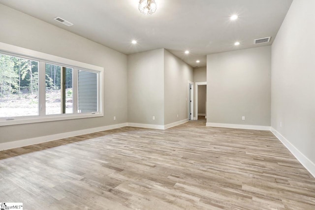 unfurnished room with light hardwood / wood-style flooring