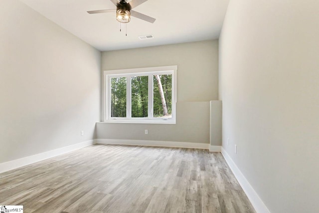 unfurnished room with ceiling fan and light hardwood / wood-style flooring