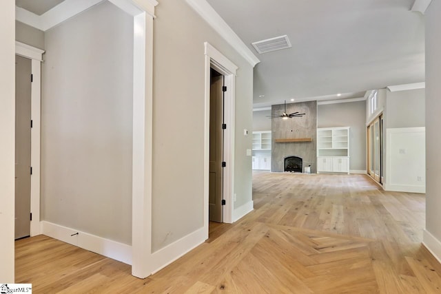 hallway featuring light parquet floors and crown molding