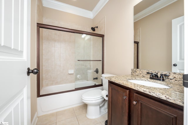 full bathroom with toilet, tile patterned flooring, ornamental molding, vanity, and bath / shower combo with glass door