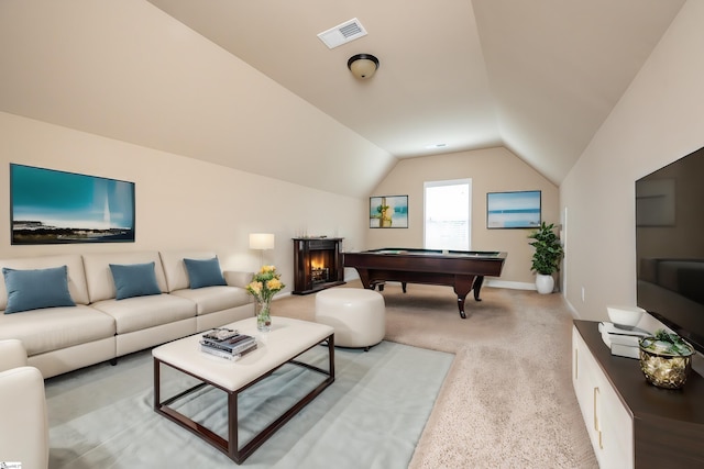 interior space with billiards, light colored carpet, and vaulted ceiling