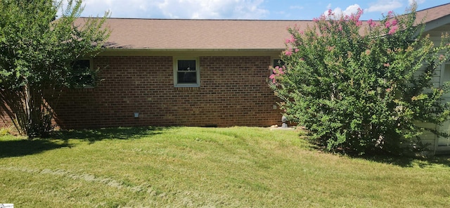 view of property exterior featuring a yard