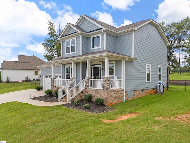 view of front of property with a garage, a front yard, and a porch