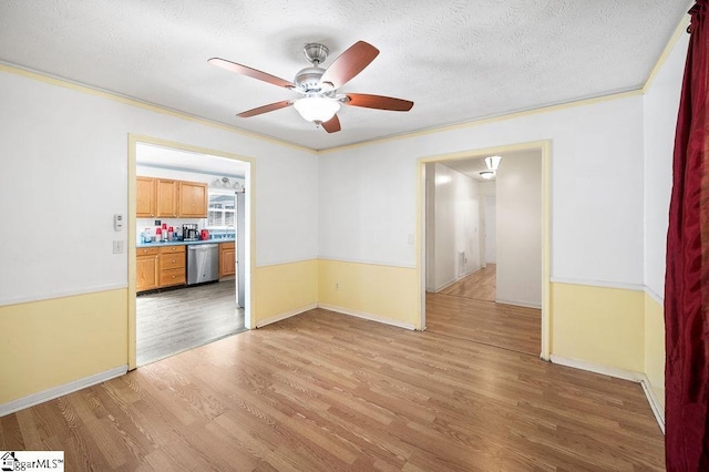 121 Sherman Ct, Piedmont, SC 29673 - empty room featuring ceiling fan, a textured ceiling, light wood-style flooring, baseboards, and ornamental molding