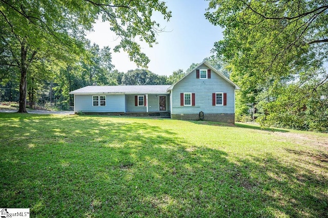 back of house with a yard