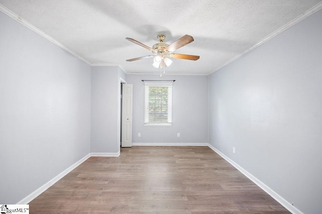 spare room featuring crown molding, a textured ceiling, ceiling fan, and light hardwood / wood-style floors