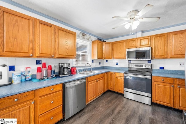 121 Sherman Ct, Piedmont, SC 29673 - kitchen featuring brown cabinets, tasteful backsplash, a sink, dark wood finished floors, and stainless steel appliances