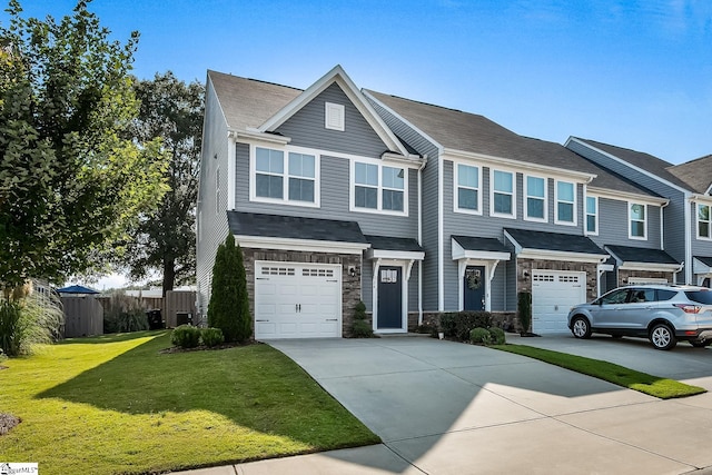 view of front of home featuring a garage and a front yard