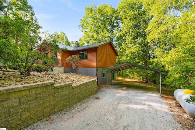 view of property exterior with a carport