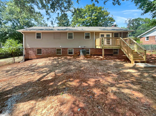 back of property featuring a deck