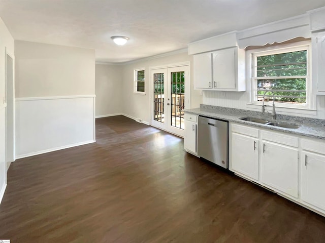 kitchen with light stone countertops, french doors, stainless steel dishwasher, sink, and white cabinetry