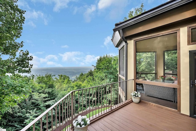 balcony featuring a water view