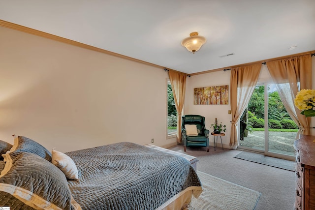 bedroom with carpet flooring, crown molding, and access to outside