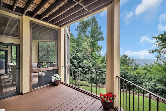 wooden deck featuring a water view