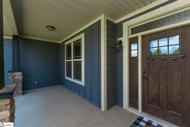 doorway to property with board and batten siding