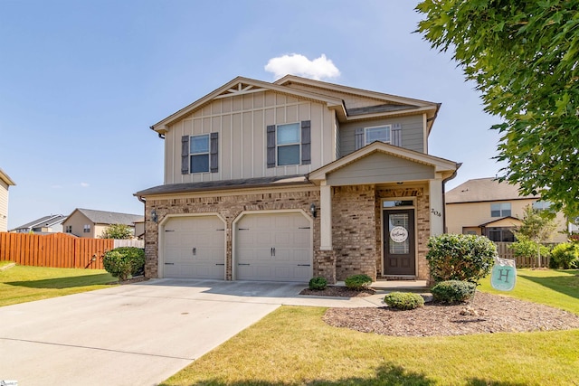 craftsman house featuring a garage and a front lawn