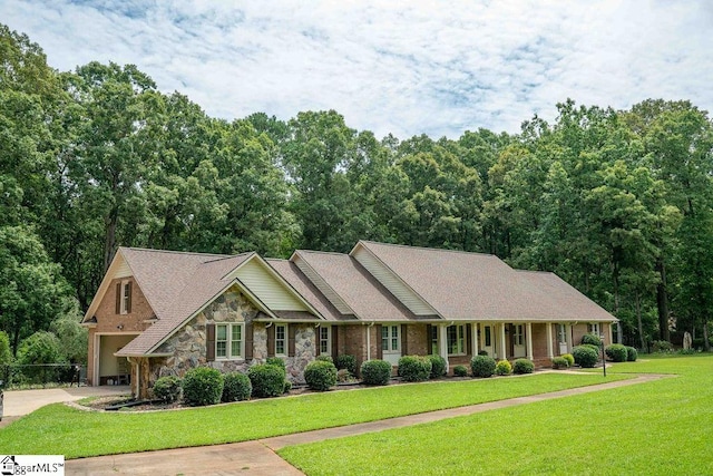 view of front of home with a porch and a front lawn