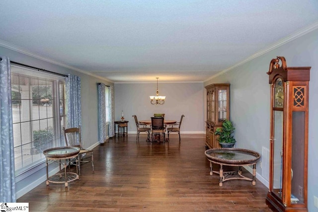 dining space featuring a chandelier, dark hardwood / wood-style flooring, and ornamental molding