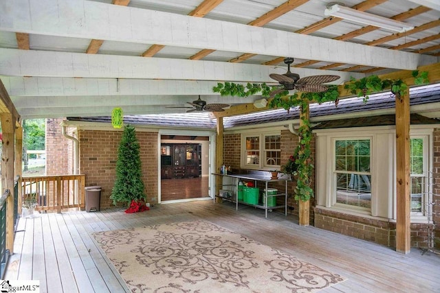 wooden deck featuring ceiling fan