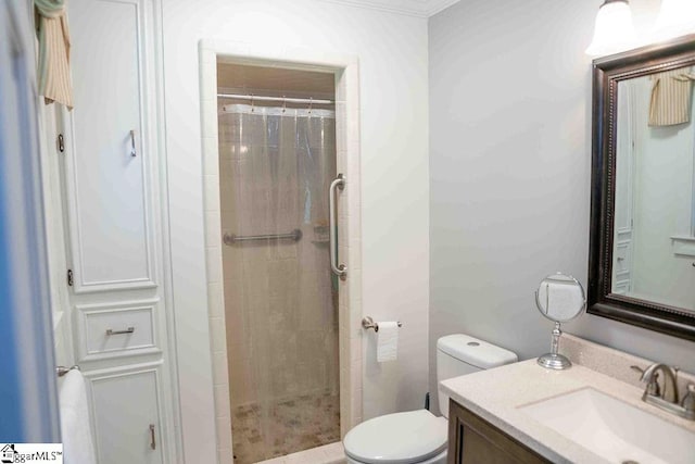 bathroom with ornamental molding, vanity, toilet, and a tile shower