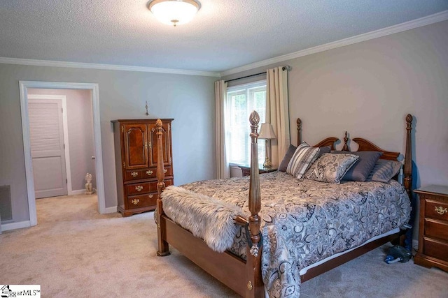 bedroom featuring light colored carpet, ornamental molding, and a textured ceiling