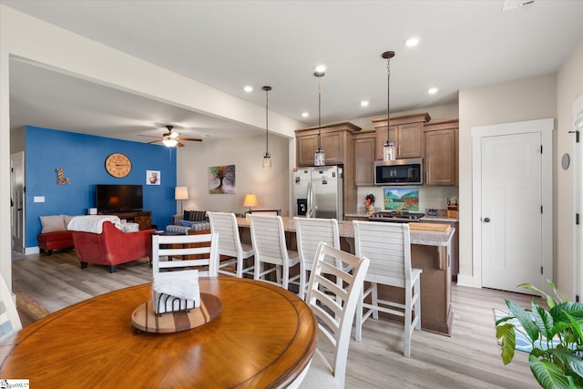 127 Addington Ln, Simpsonville, SC 29681 - dining room with baseboards, light wood-type flooring, ceiling fan, and recessed lighting