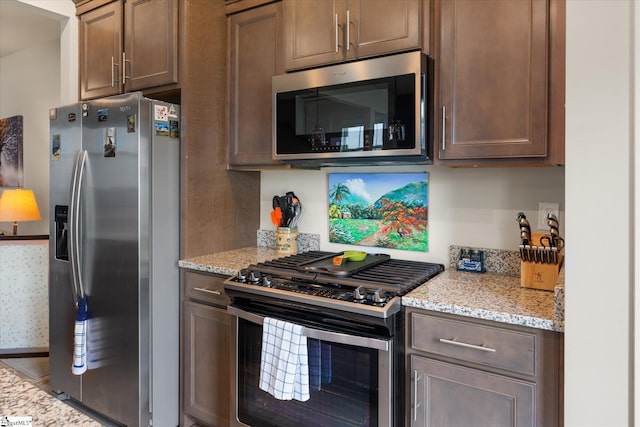 127 Addington Ln, Simpsonville, SC 29681 - kitchen featuring light stone countertops and stainless steel appliances