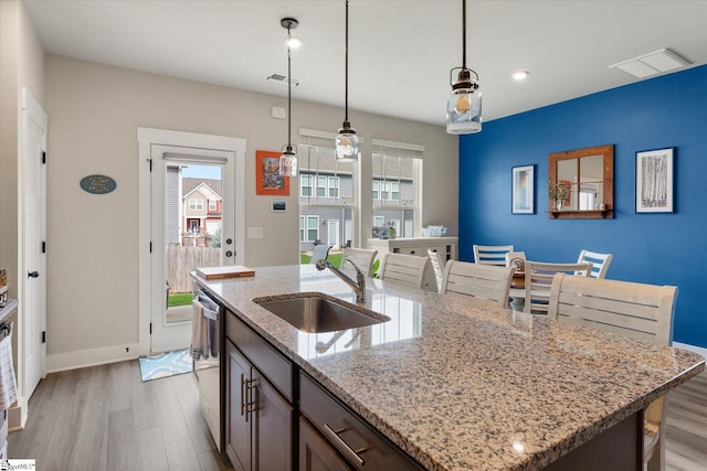 127 Addington Ln, Simpsonville, SC 29681 - kitchen with visible vents, light wood-style floors, a sink, and dishwasher