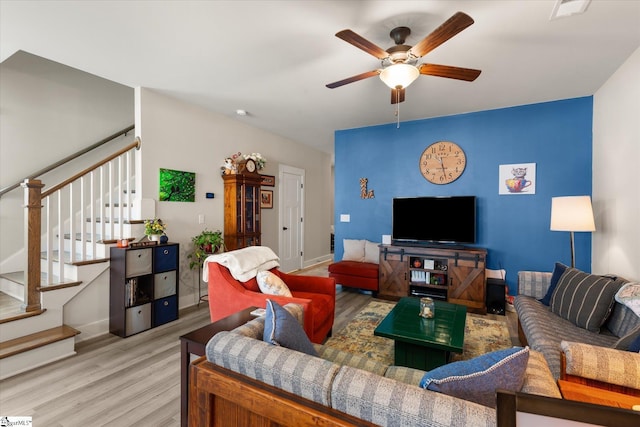 127 Addington Ln, Simpsonville, SC 29681 - living area with visible vents, light wood-style flooring, baseboards, stairway, and a ceiling fan