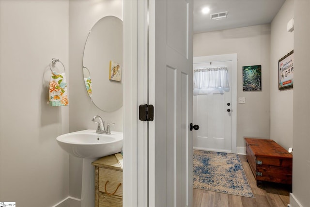 127 Addington Ln, Simpsonville, SC 29681 - bathroom with baseboards, visible vents, and wood finished floors