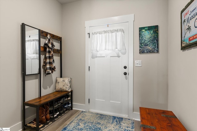 mudroom with light hardwood / wood-style floors