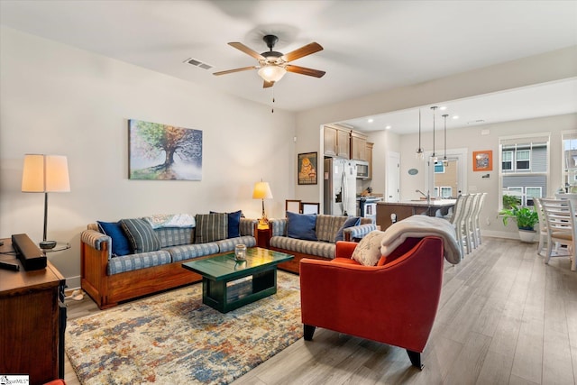 127 Addington Ln, Simpsonville, SC 29681 - living area with light wood-style flooring, visible vents, baseboards, ceiling fan, and recessed lighting