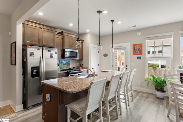 127 Addington Ln, Simpsonville, SC 29681 - kitchen featuring a sink, light wood finished floors, visible vents, and appliances with stainless steel finishes