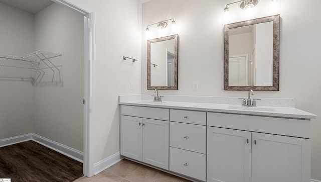 bathroom with tile patterned flooring and vanity