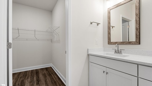 bathroom with vanity and hardwood / wood-style floors