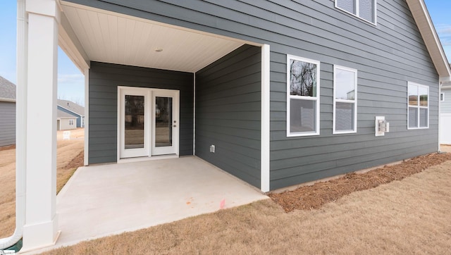 entrance to property featuring a patio area