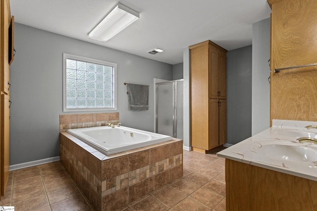 bathroom featuring vanity, separate shower and tub, and tile patterned floors