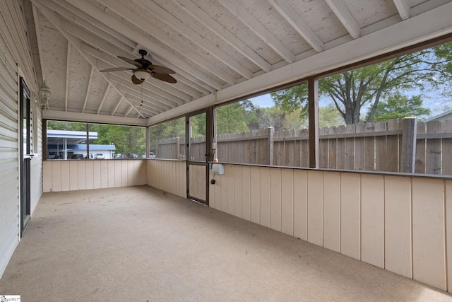 unfurnished sunroom featuring ceiling fan and lofted ceiling