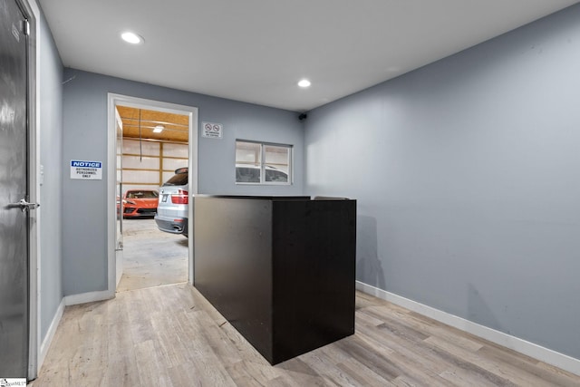 office with light hardwood / wood-style floors