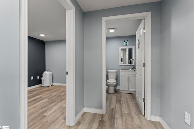 bathroom featuring vanity, hardwood / wood-style floors, and toilet