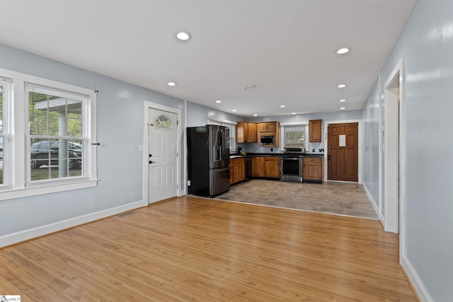 kitchen featuring appliances with stainless steel finishes and light wood-type flooring