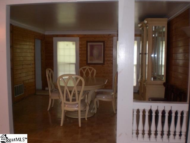 dining room featuring crown molding