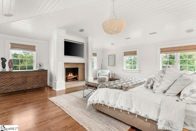 bedroom with wood-type flooring and wooden ceiling