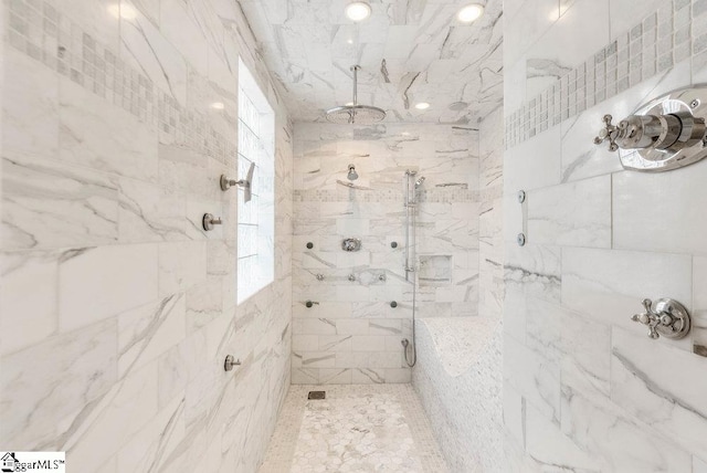 bathroom with a tile shower