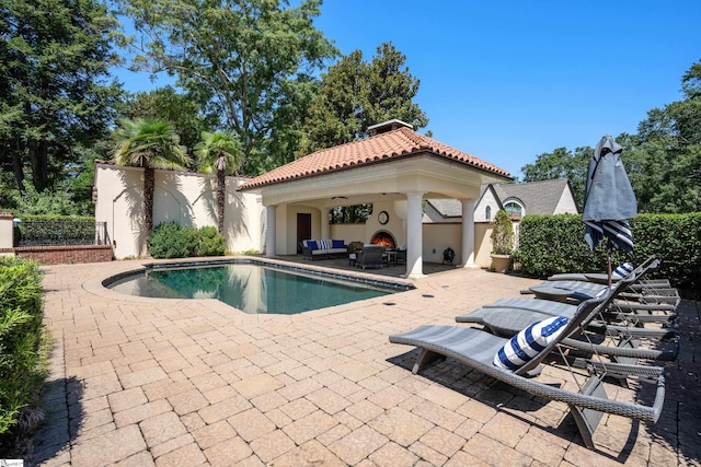 view of pool featuring a gazebo and a patio